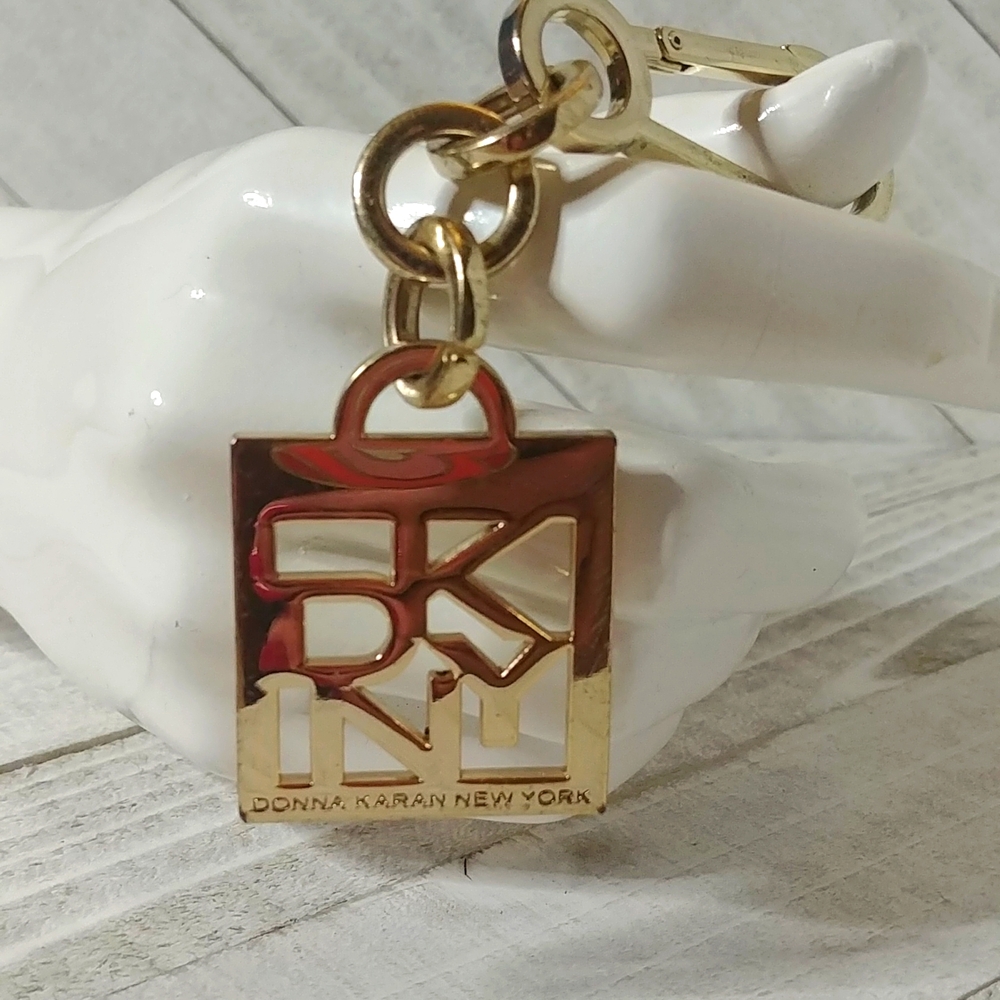 DKNY Donna Karen New York Gold Toned Key Holder